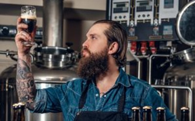 Bartender holding up drink