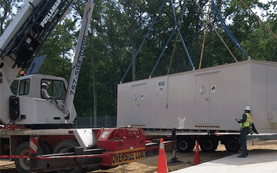 A modular chemical storage building from U.S. Chemical Storage being unloaded.