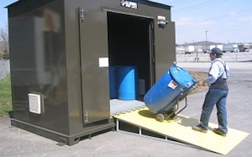 Man bringing chemical storage container