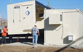 A U.S. Chemical Storage building being installed onsite.