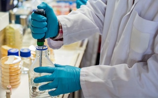 Doctor mixing chemicals together that will need to be stored safely