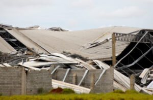 Industrial facility warehouse space after high winds causes it to collapse