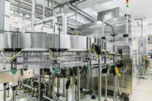 A look inside a food and beverage bottling plant factory with modern equipment