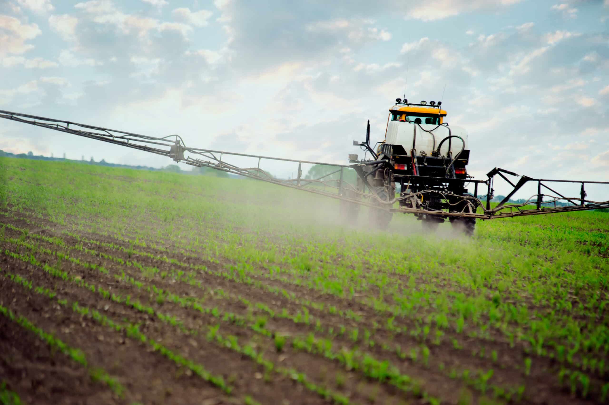 a tractor sprays crops with fertilizer which is often stored is expertly designer commercial lawn storage buildings