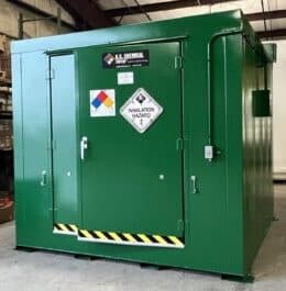 Green US Chemical Storage DrumLoc building with 3-point lock double-leaf door, lights, shelving and ventilation for pesticide storage at golf course