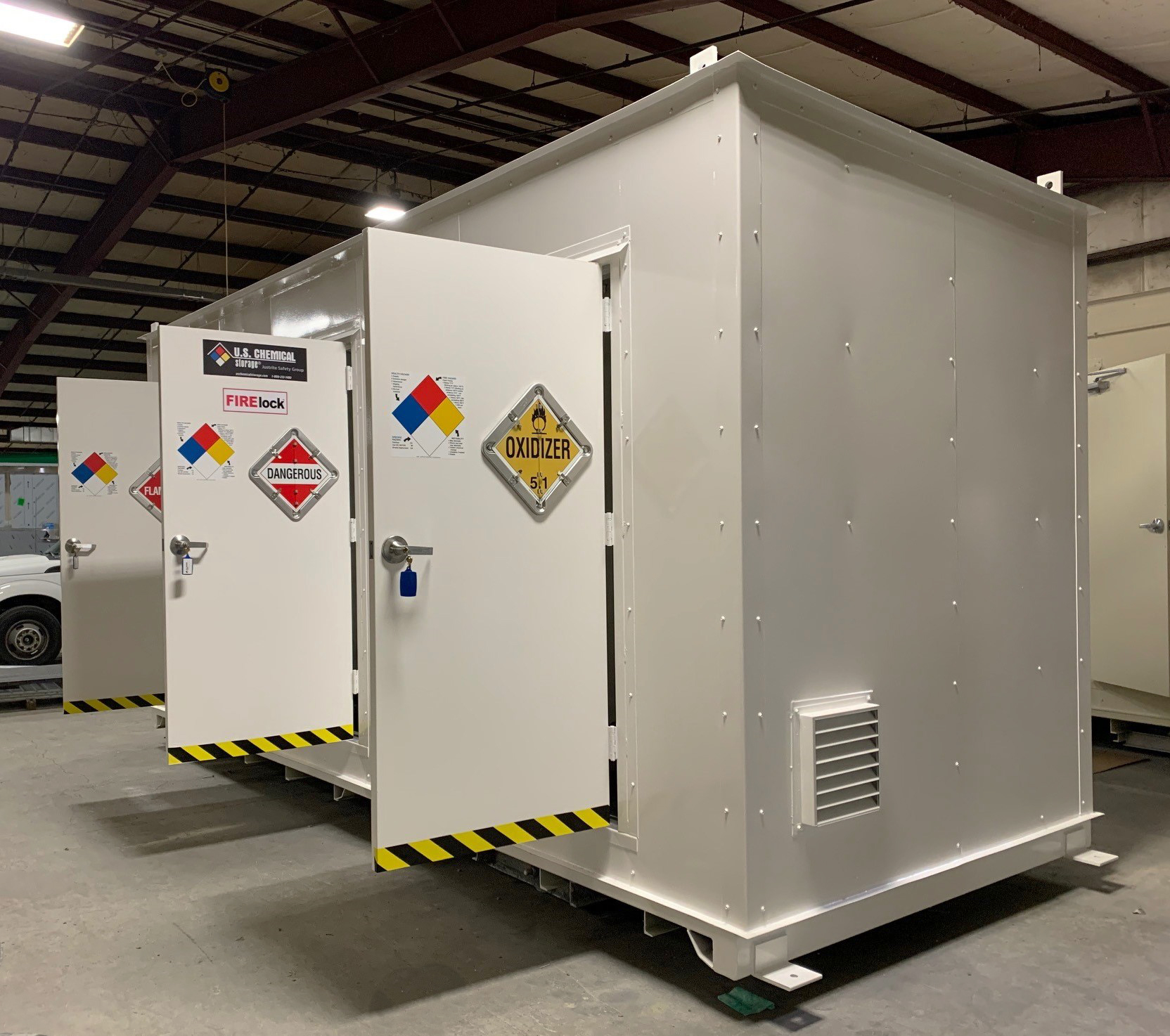 Fireloc multi-room building with doors open and ready for shipping to the customer. Storing and charging of lithium batteries are one use for this type of building.
