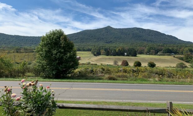 Photo of the blue ridge mountains of West Jefferson from the front door of American Emergency Vehicles. Beautiful trees and pasture land. 