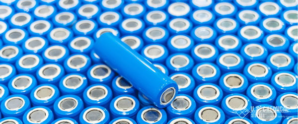 Dozens of blue wrapped lithium battery cells stacked tightly together